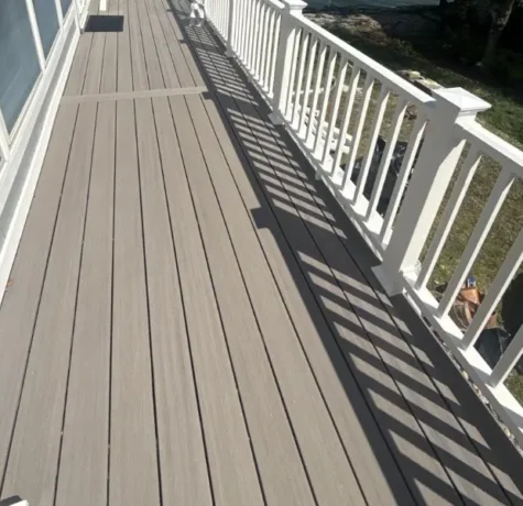 Composite deck with white railings on a lakefront home in Hopatcong NJ