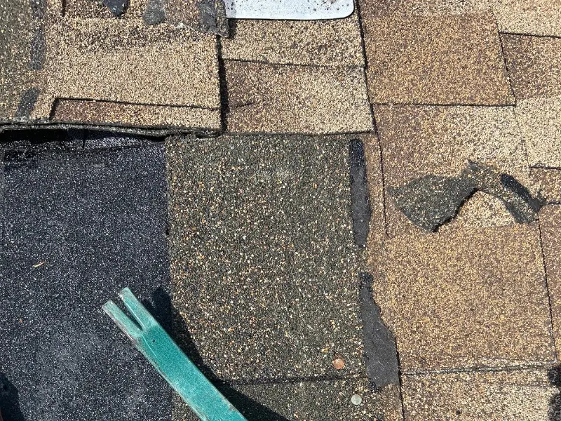 Herts crew replacing damaged shingles during a roof repair in Rahway NJ