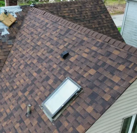 New architectural shingle roof with a skylight, replaced by Herts in Norwood NJ