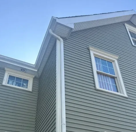 Gray lap siding and white trim on a two-story home in Westfield NJ