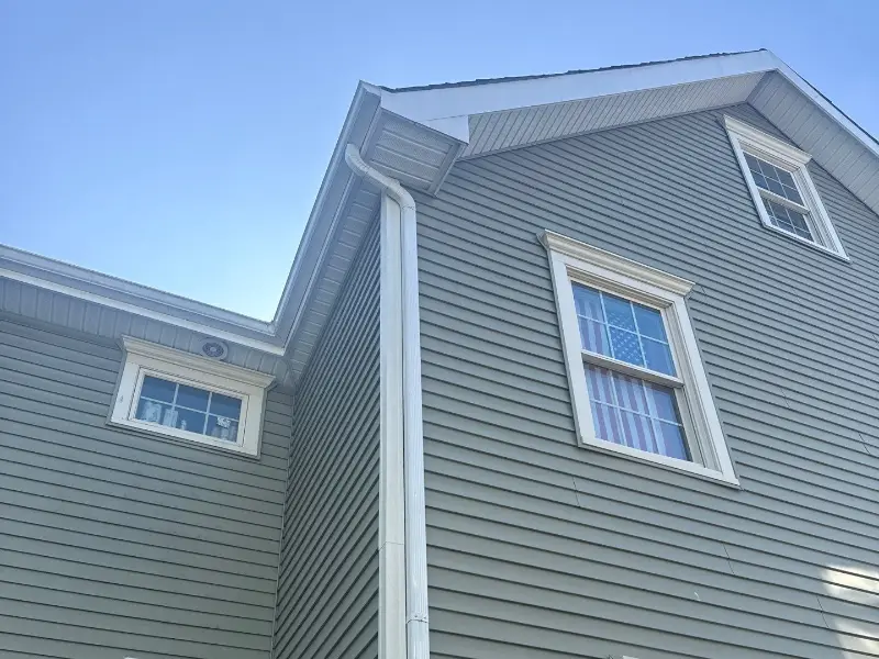 Gray lap siding and white trim on a two-story home in Westfield NJ