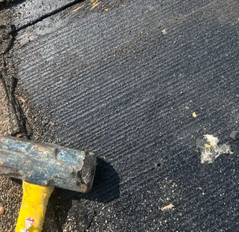 Torn shingles and exposed underlayment found on a roof inspection in Rahway NJ